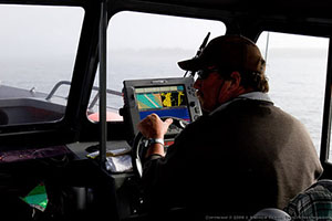 Captain Toby at the Helm in Foggy Tillamook Bay